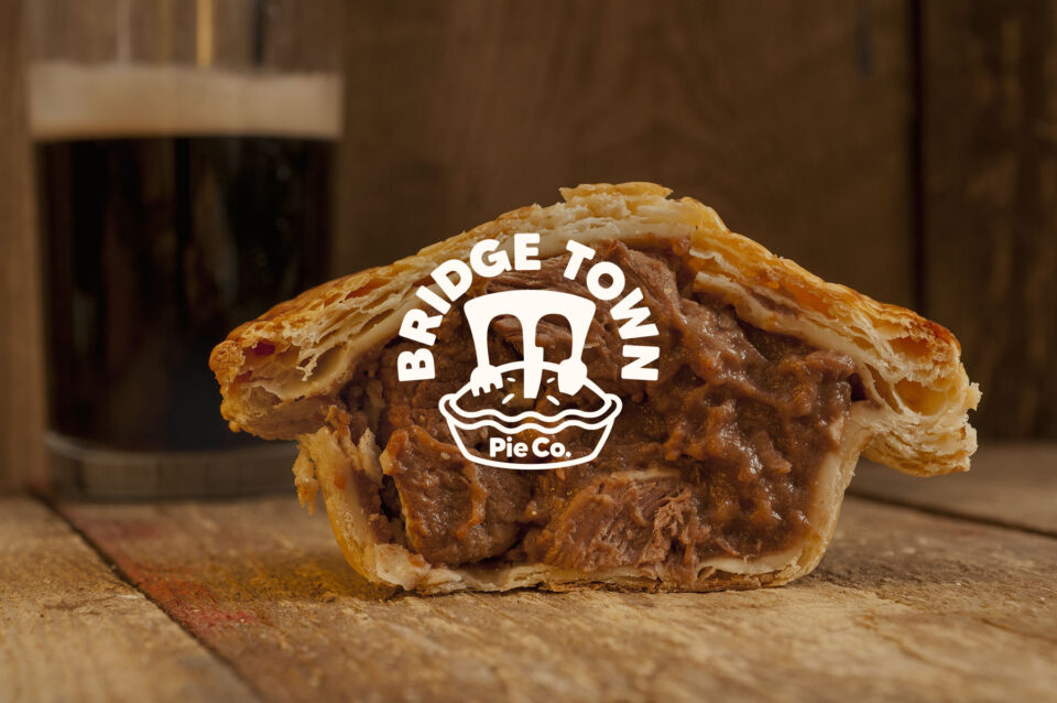 Half,Of,A,Steak,And,Ale,Pie,On,A,Wooden